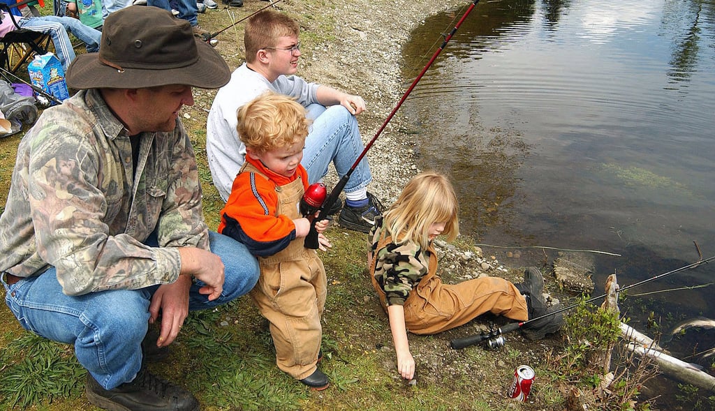 https://go2fishing.com/wp-content/uploads/2023/11/wyatt-bailey-mans-his-fishing-pole-while-brother-johnny-and-sister-elizabeth-1b3ff0-1024.jpg